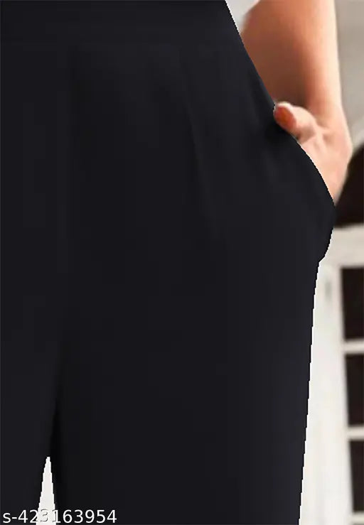 Black polyester blend narrow fit trousers with two side pockets and a mid waist design, size 42