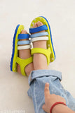Butterscotch ONYC sandals with neon green straps and accents