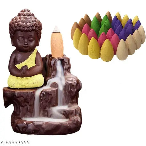 This is a figurine of a meditating Buddha, placed on what appears to be a faux rock, with a set of colorful incense sticks at its feet. It's part of a home decor set that includes backflow incense and a candle, both housed in ceramic containers resembling the colorful incense