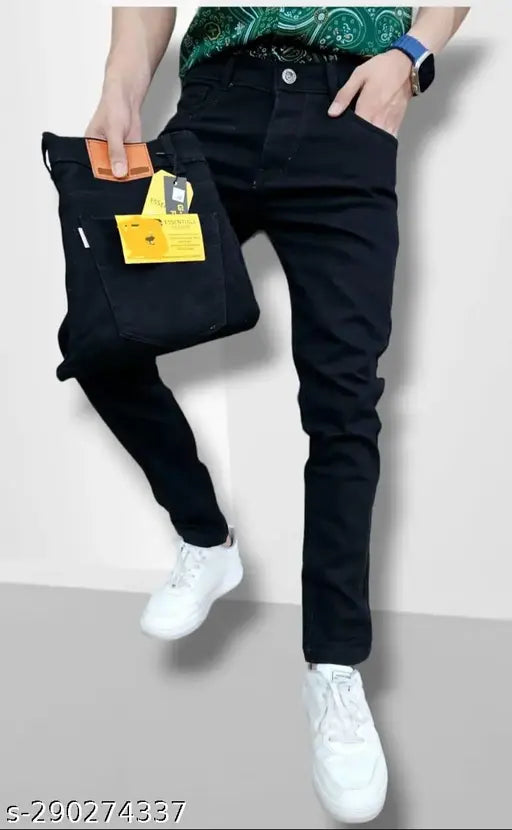 Men's black cotton skinny fit jeans, versatile and comfortable for everyday wear or a night out. Solid design with a touch of stretch fabric, perfect for various tops and footwear. Available in sizes 28, 30, and 32. Made in India. #Blackskinnyjeans #Mensskinnyjeans #Cottonjeans #Denimjeans