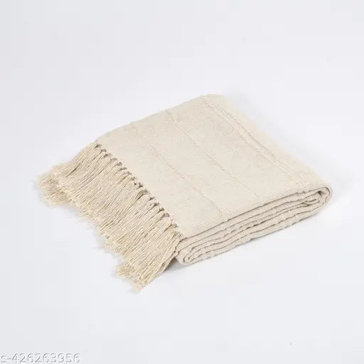 Beige cotton throw blanket for sofa or bed