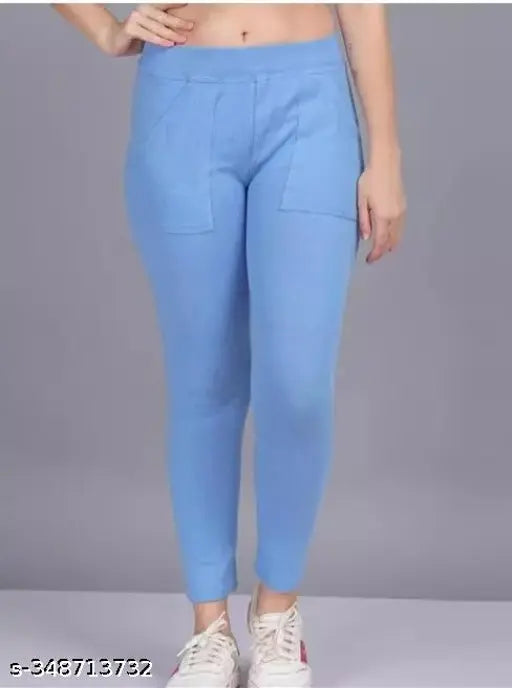 Denim blue Lycra women's pocket jegging, trendy solid pattern, size 28/30/32/34 on display rack