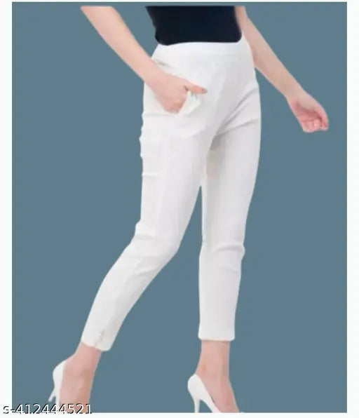 A woman wearing white high-waisted skinny jeans