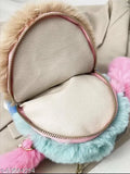 Trendy fuzzy sling bag with gold zipper, blue pom poms