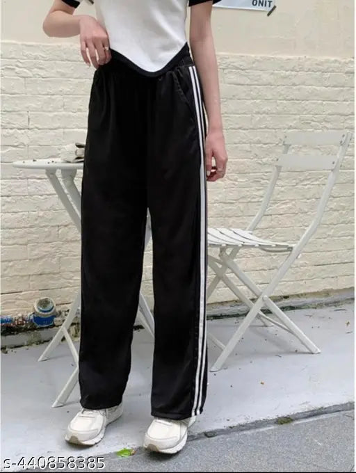 Black jogging pants with white side stripes and lower waistband