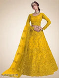 yellow embroidered party wear lehenga choli & dupatta set on mannequin, semi-stitched net fabric with intricate patterns