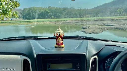 Multicolor polyresin Lord Ganesha idol for home decor and car dashboard, perfect for religious and gift use, handcrafted showpiece for living room or bedroom