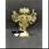 Gold metal idol with multiple arms, traditional design on a dark background
