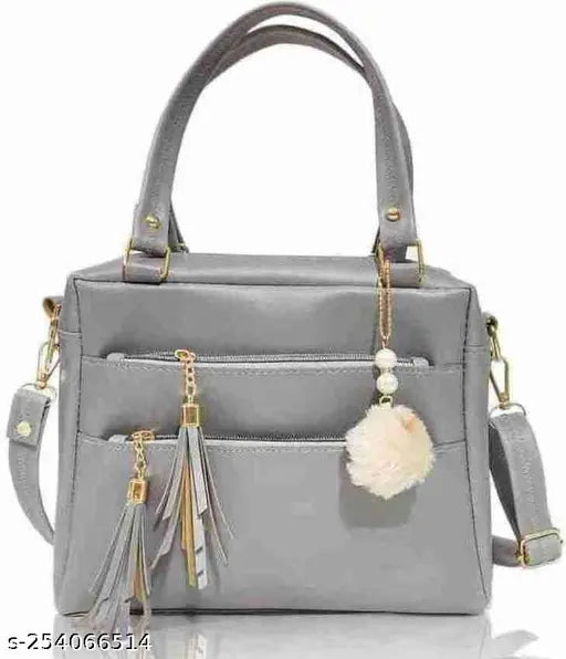 Grey leather sling bag with fringe details and multiple pockets
