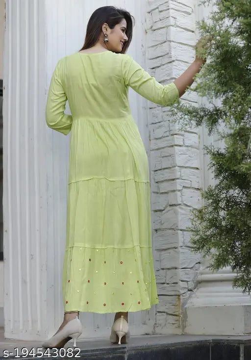 Green Rayon Kurti Flair Gown with embroidery and solid print, three-quarter sleeves. Medium length designer Indian dress for women