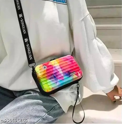 Colorful fabric clutch bag with vibrant rainbow design and a wrist strap