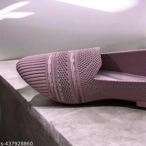 This is a picture of shoes. It shows a pair of pink shoes with a lace texture on the side, and they are displayed against a white background. The style appears to be casual or dailywear
