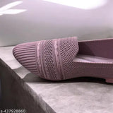 This is a picture of shoes. It shows a pair of pink shoes with a lace texture on the side, and they are displayed against a white background. The style appears to be casual or dailywear