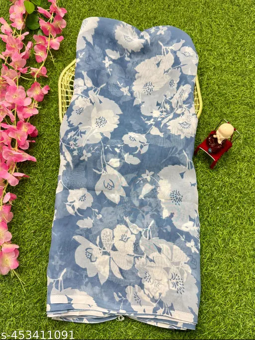 Blue and white patterned Sarika Georgette saree, possibly cotton or silk, with no visible branding or closure details