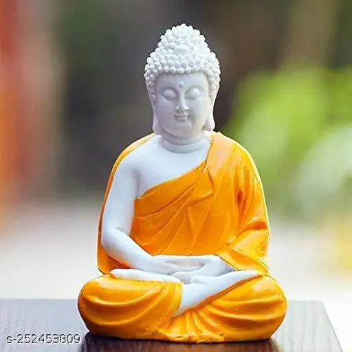Orange ceramic Buddha statue sitting in meditation pose