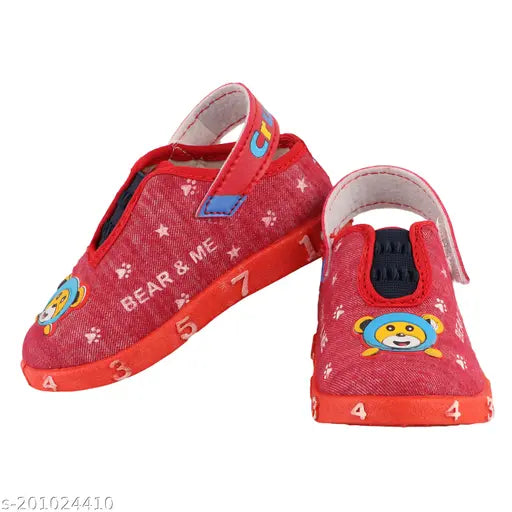 Red and white children's sneakers with bear motif