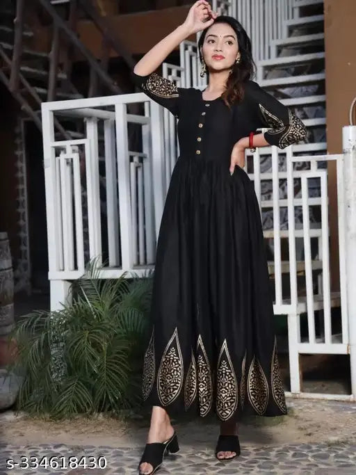 Gold-print rayon kurti with varying handmade pattern, traditional Indian artistry on display
