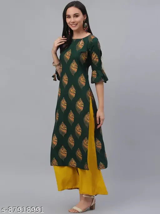 Rayon kurta set with printed net design, featuring three-quarter sleeves and matching palazzos in green and mustard yellow. Indian women's fashion