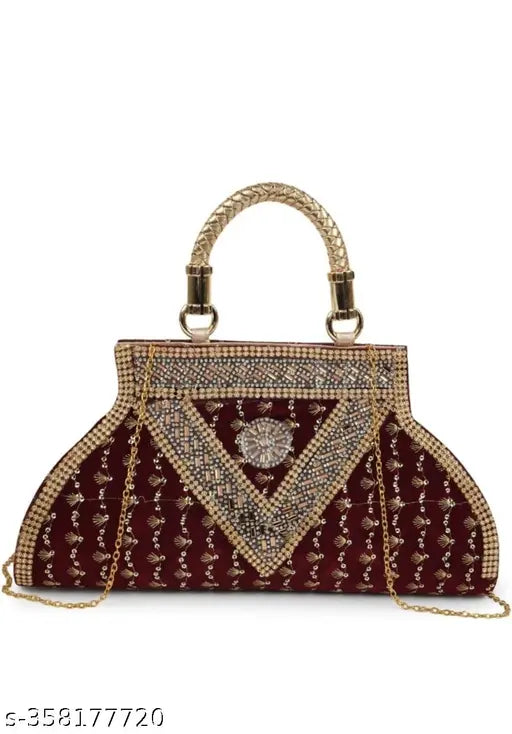 Red beaded clutch with metallic accents, designed with a gold chain