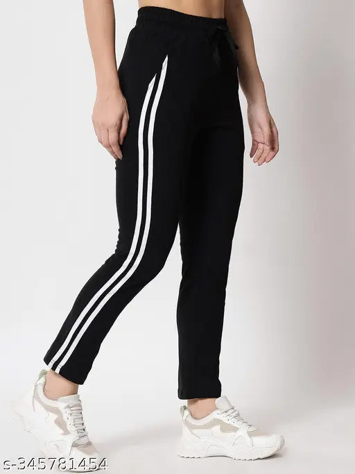 Black athletic jogger pants, striped Adidas brand waistband, cropped length