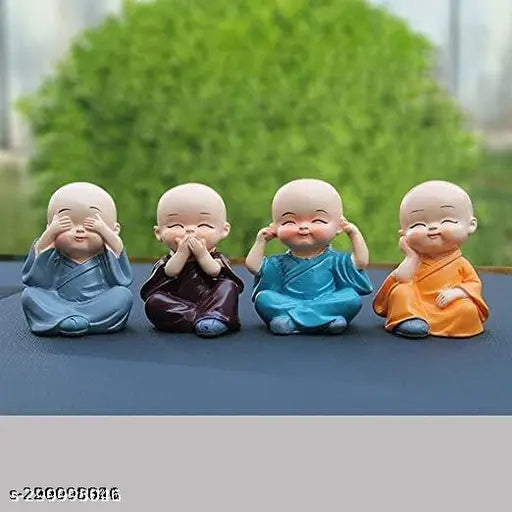 Four ceramic figurines, each with a different pose and expression