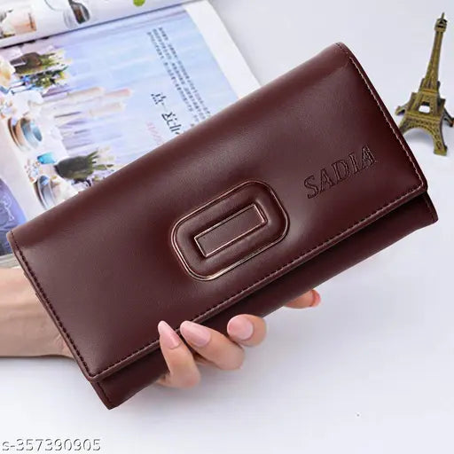 Brown faux leather wallet with a closure mechanism