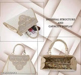 Stylish sling handbag with two straps, gold accents, black and white pattern