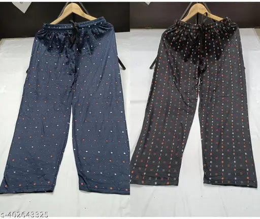 Blue and black polka dot patterned pants, possibly cotton