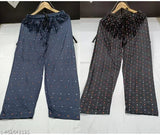Blue and black polka dot patterned pants, possibly cotton