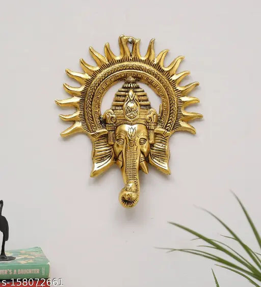 Metal Ganesh idol with Surya Chakra, brass finish and antique gold plating, traditional decorative showpiece for home or worship, 23cm height, 18cm breadth, 3cm length