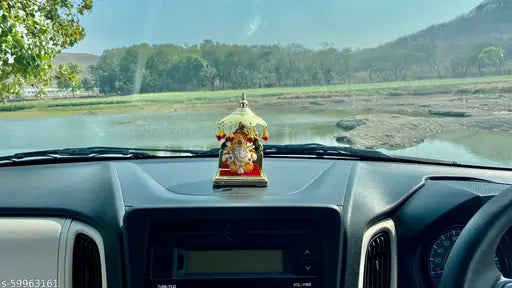 Multicolor polyresin Lord Ganesha idol for home decor, elegant and religious, perfect for living room or car dashboard