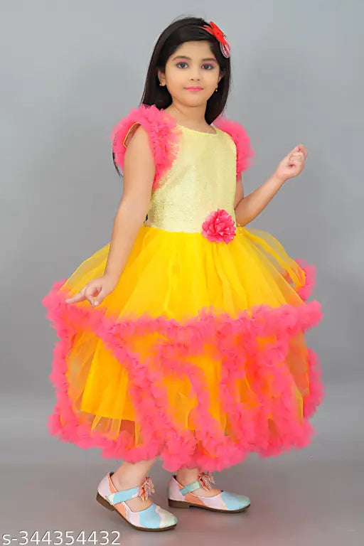 Long yellow tulle girls' party dress with ruffles and feathers
