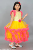 Long yellow tulle girls' party dress with ruffles and feathers