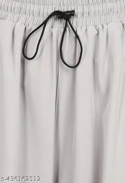Grey jogging pants with elastic waistband and black drawstring