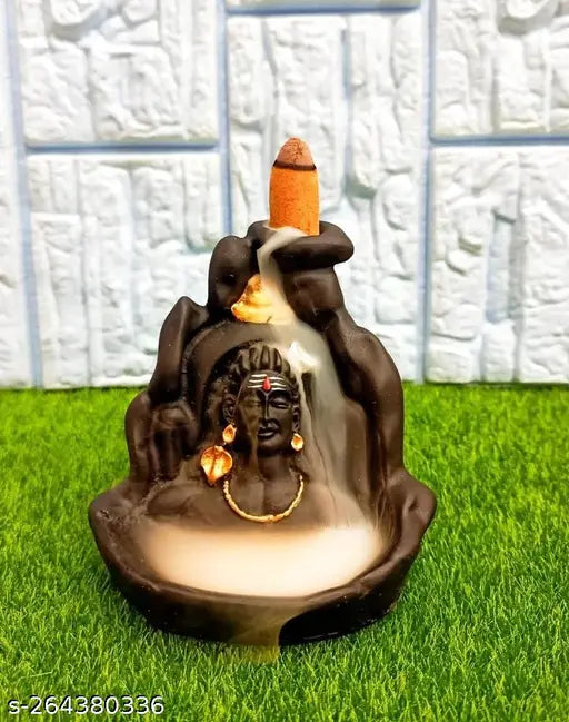 Brown ceramic incense holder with a backflow smoke effect, representing Lord Shiva and Adiyogi