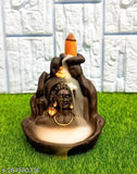 Brown ceramic incense holder with a backflow smoke effect, representing Lord Shiva and Adiyogi