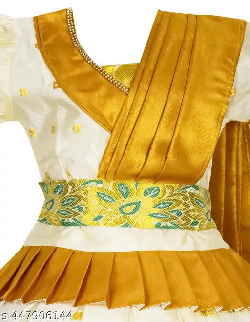 White cotton Lehanga Choli set with golden zari accents, traditional Kerala Pavada for kids' festive occasions