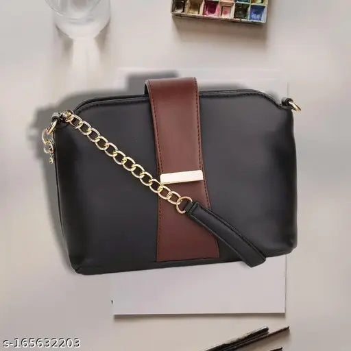 Sleek brown leather shoulder bag with gold chain accents, zip closure and chain strap