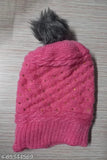 Magenta wool cap with fur lining, pompom top embellishment