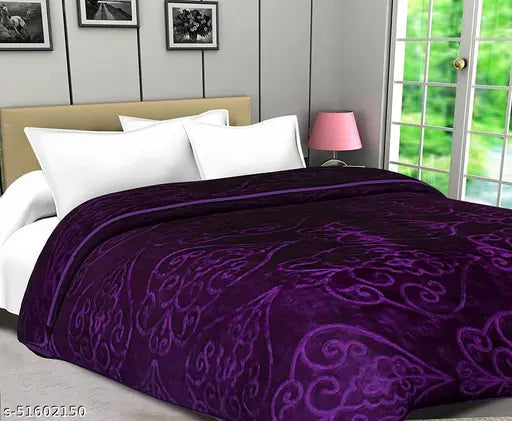 Purple polyester double mink floral blanket, ideal for heavy winter use by adults. Soft and cozy on a bed