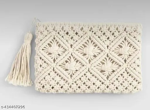 Handmade cream macrame clutch with tassel, featuring one main compartment with zip closure and two side pockets. Size: 20cm height, 30cm width. Includes a tassel charm