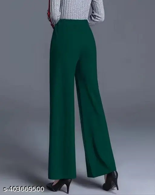 Green high-waisted trousers with wide legs and slits