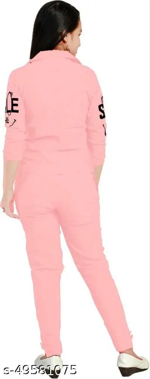 Pink dress with black trim, long sleeves, available for 45, 56, 67 years