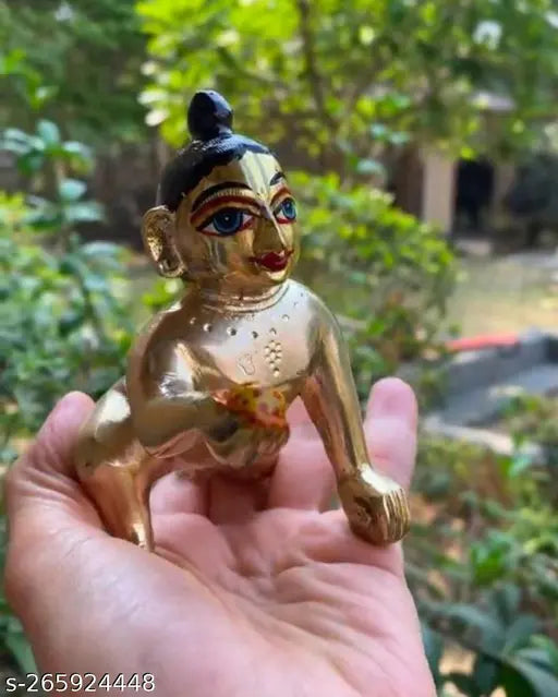Brass modern Krishna idol, hand-painted with netr shringar and gold color, for pooja puja ghar temple decor. Indian religious figurine for Janmashtmi celebration, 8cm x 5cm x 8cm in size
