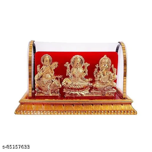 Golden plastic idols of Lord Ganesh, Maa Lakshmi, and Saraswati from India