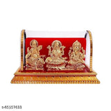 Golden plastic idols of Lord Ganesh, Maa Lakshmi, and Saraswati from India