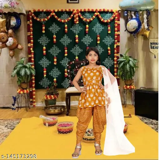 Yellow Jaypuri cotton print dhoti kurta set for girls with matching dupatta, anarkali shape and sleeveless top. Playful pastel design, comfortable for 6-13 year olds. Indian origin