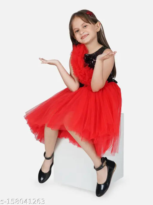Red ruffled girl's dress, asymmetrical bodice, red sequin detailing, knee-length