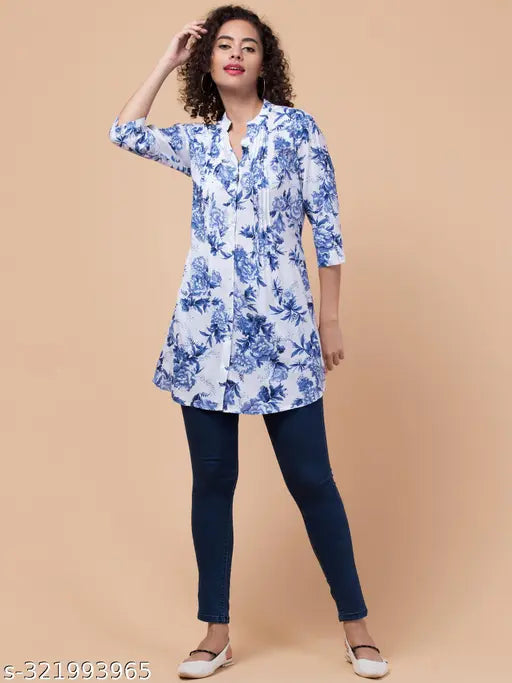 Rayon blue floral tunic with 3/4 sleeves, mandarin collar and front pleats, India origin