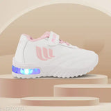 A pair of lightweight, casual LED shoes for children, featuring a pink and white design with Velcro straps